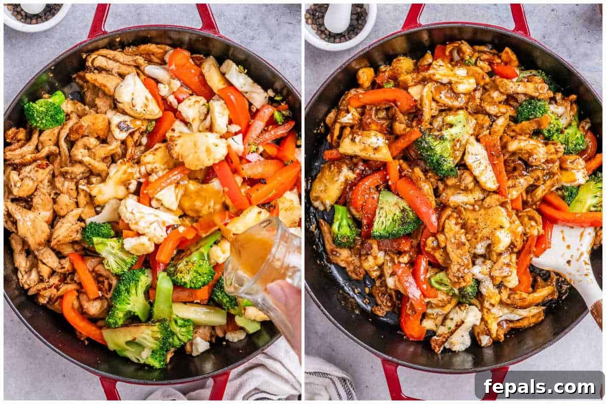 Action shot in a large red-handled pan: stir-frying marinated chicken pieces with sliced red bell peppers, broccoli florets, and cauliflower, with a white spatula tossing the ingredients.