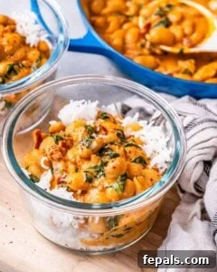 A bowl of rice topped with marry me butter beans.