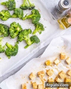 Broccoli and tofu are being prepared to be baked.