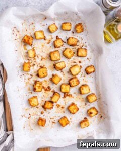 Baked tofu bites on a sheetpan.