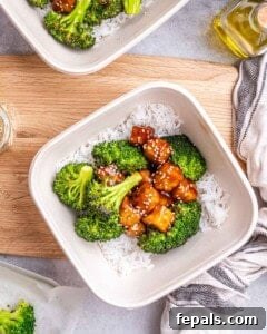 Serving the tofu over rice and roasted cauliflower in a bowl.