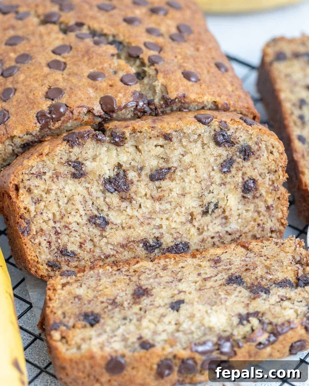 Nutty Browned Butter Banana Loaf 7 Slices of browned butter banana bread arranged on a wire rack, ready to be enjoyed.