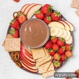 Valentine's Day Recipes for Grown-Ups 14 Top view yogurt dip in a bowl with crackers and fruits.