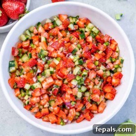 Valentine's Day Recipes for Grown-Ups 15 Top view of strawberry salsa in a round white bowl.