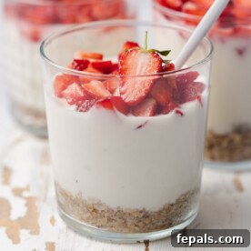 Valentine's Day Recipes for Grown-Ups 18 a clear cup with no bake cheesecake topped with fresh chopped strawberries.