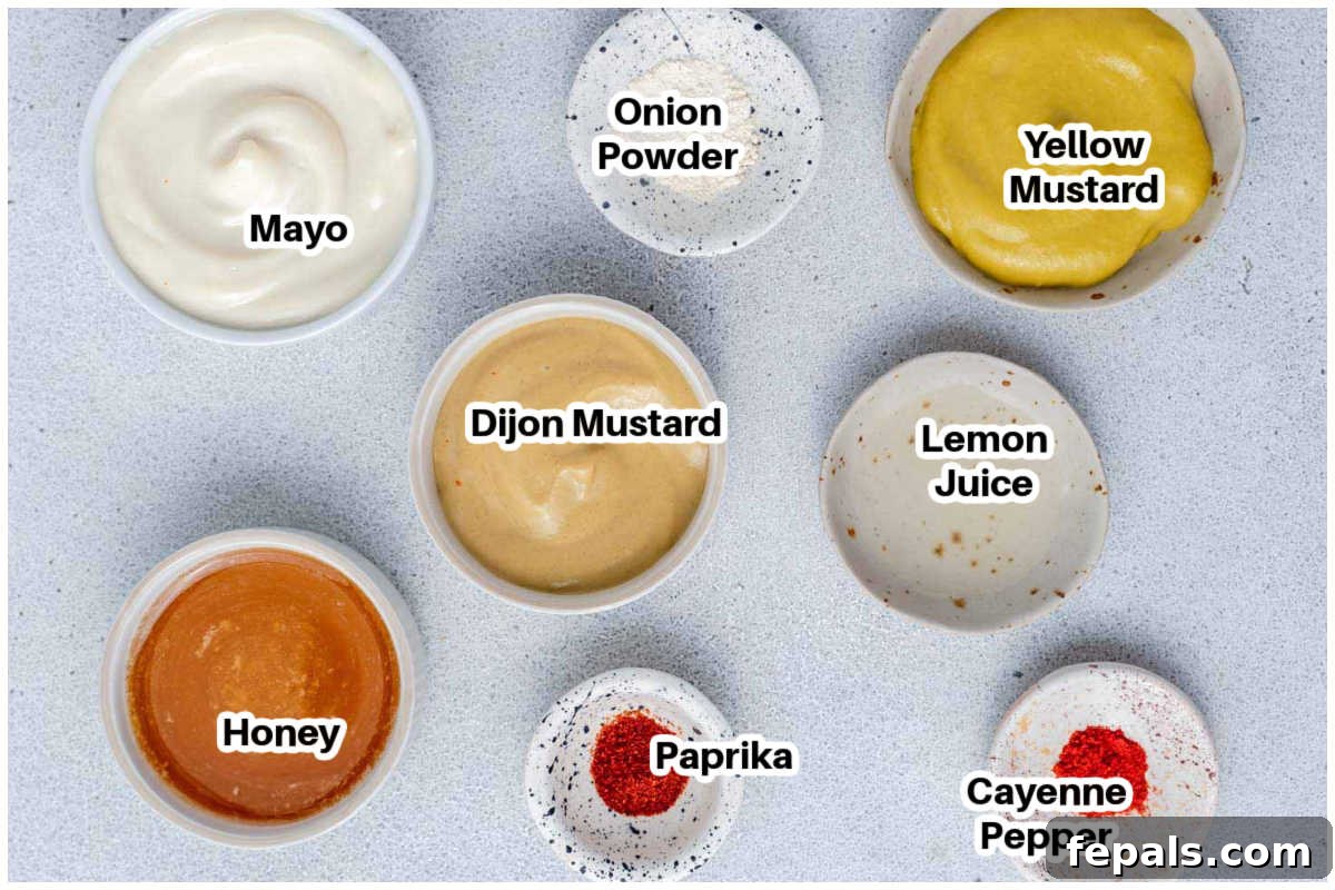 A flat lay photograph showing all the individual ingredients laid out to make honey mustard dipping sauce.