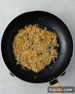Decadent French Onion Dip 11 Process shot showing sauteing the onions in a pan.