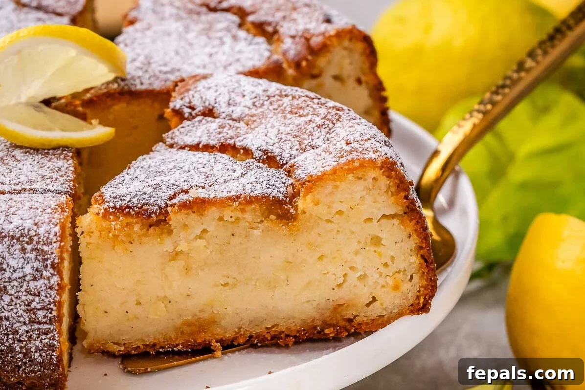 A beautifully baked lemon ricotta cake, cooled and ready to be enjoyed, with a perfect slice removed.