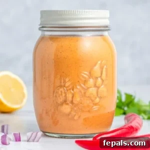 A sealed jar with peri peri sauce.