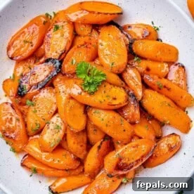 roasted honey glazed carrot bites on a white plate to be served.