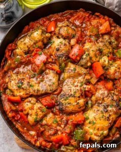 Chicken cacciatore simmering in a skillet