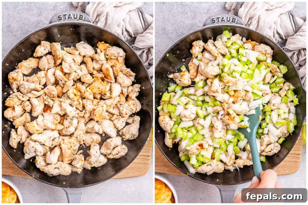 Process shot showing chicken bites being cooked in a pan with diced onions and celery.