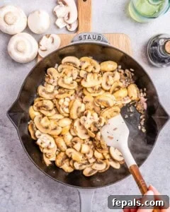 Cooking the mushrooms in a skillet.
