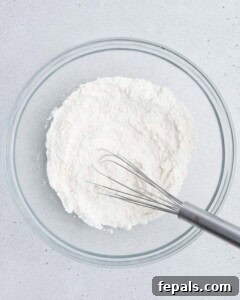 flour mixture being mixed in a bowl.