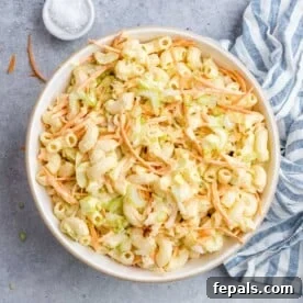 A large, inviting bowl of Hawaiian Mac Salad, showcasing its vibrant colors and rich, creamy texture, ready to be served.