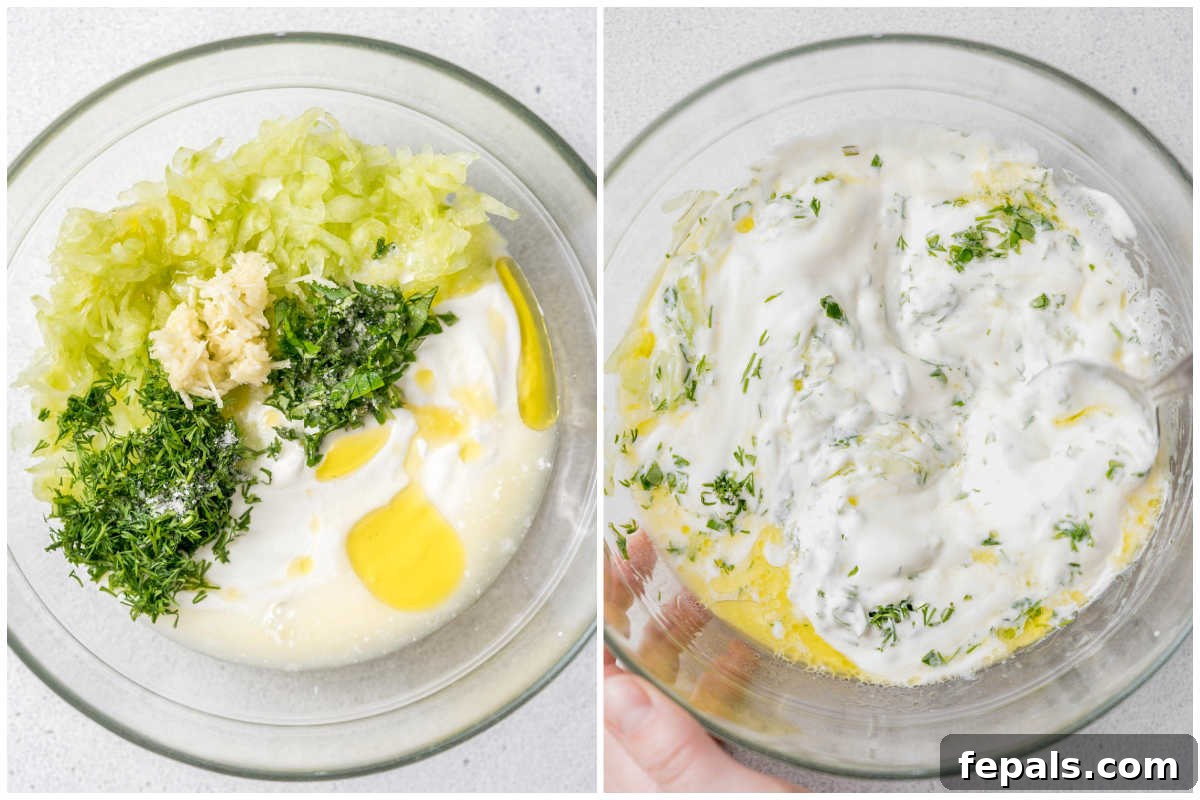 A mixing bowl filled with all the combined ingredients for tzatziki, showing its creamy texture and bits of cucumber and herbs evenly distributed.