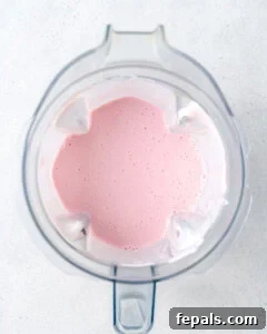 blended strawberry smoothie in a blender.