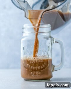 pouring coffee shake into a jar.