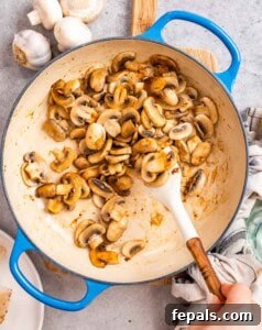 Golden Pan-Seared Chicken Medallions 12 Sautéing mushrooms in a skillet.