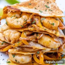Effortless Cinco De Mayo Feast 14 front view of shrimp quesadillas with parsley and lime wedges