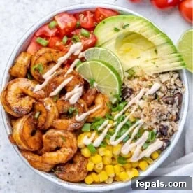 Effortless Cinco De Mayo Feast 9 top view shrimp burrito with avocado, cauliflower rice, tomatoes, and corn