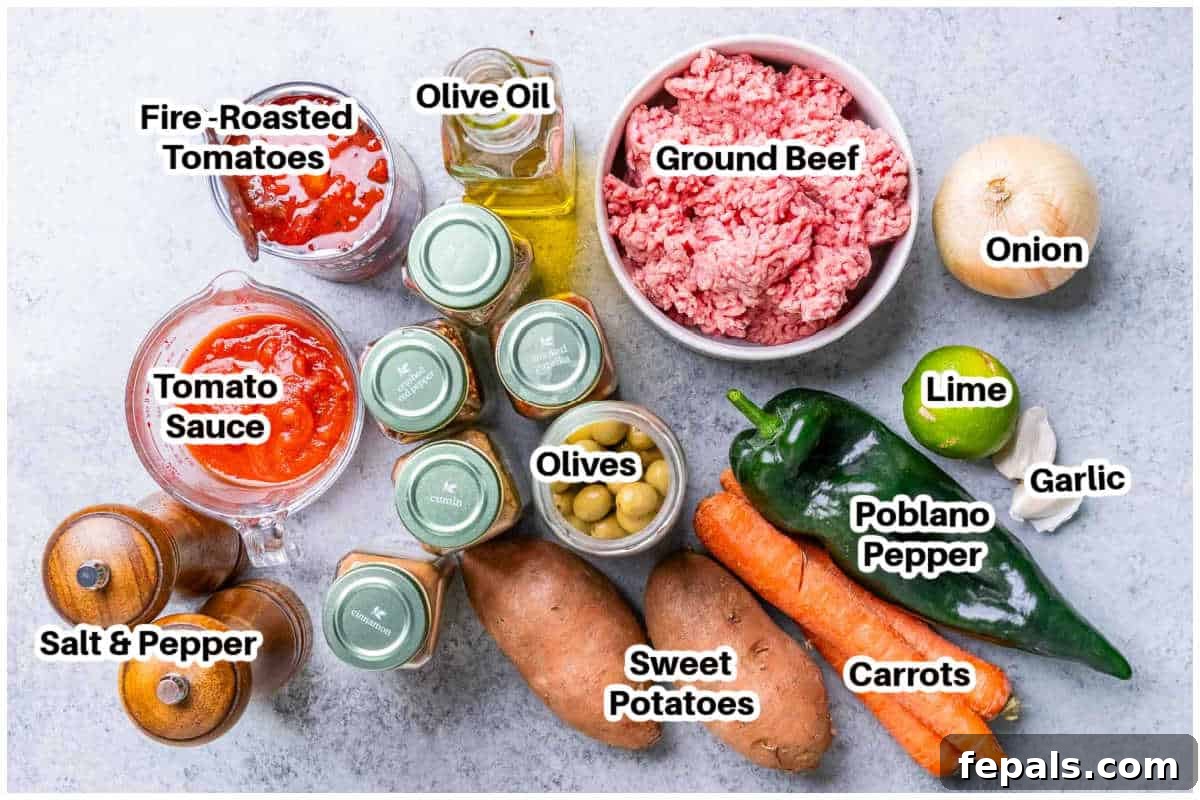 Hearty Mexican Picadillo 3 A vibrant selection of ingredients laid out, ready to make Mexican Picadillo, including fresh vegetables, spices, and canned goods.