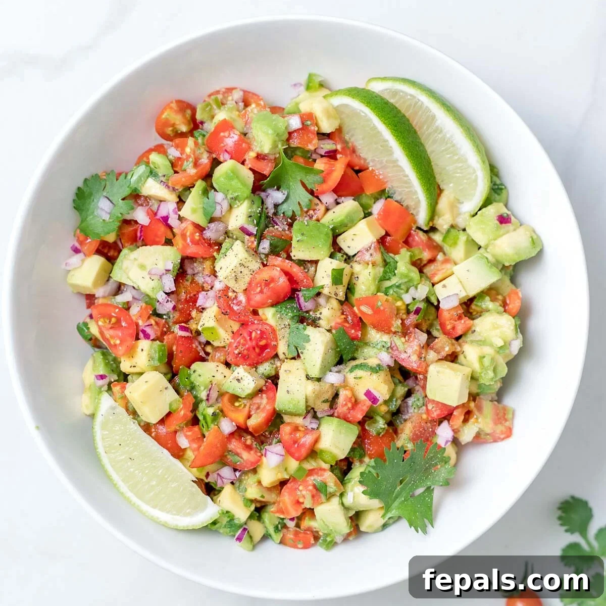 Another view of the delicious avocado salsa in a bowl, showcasing its vibrant texture and color.