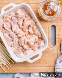 Firecracker Chicken Skewers 10 Chicken marinating in the sauce