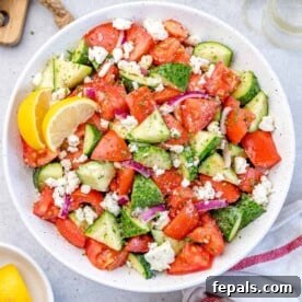 Top BBQ Side Dishes: 18+ Recipes for Summer Gatherings 10 top view tomato cucumber salad in a white plate