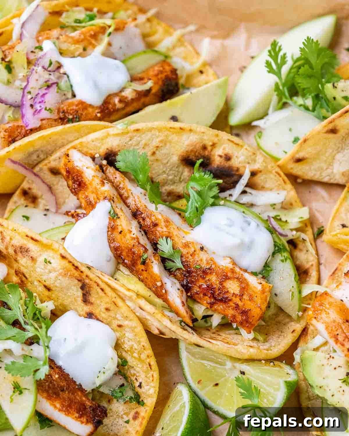 Crispy Mahi Mahi Tacos with Cilantro-Lime Crema 2 A close up of mahi mahi fish tacos with apple cabbage slaw.