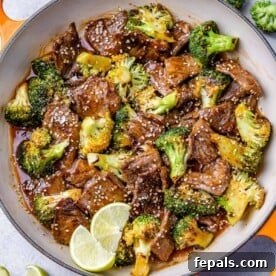 15-Minute Beef Dinners for Busy Weeknights 21 top view beef stir fry with broccoli in an orange skillet