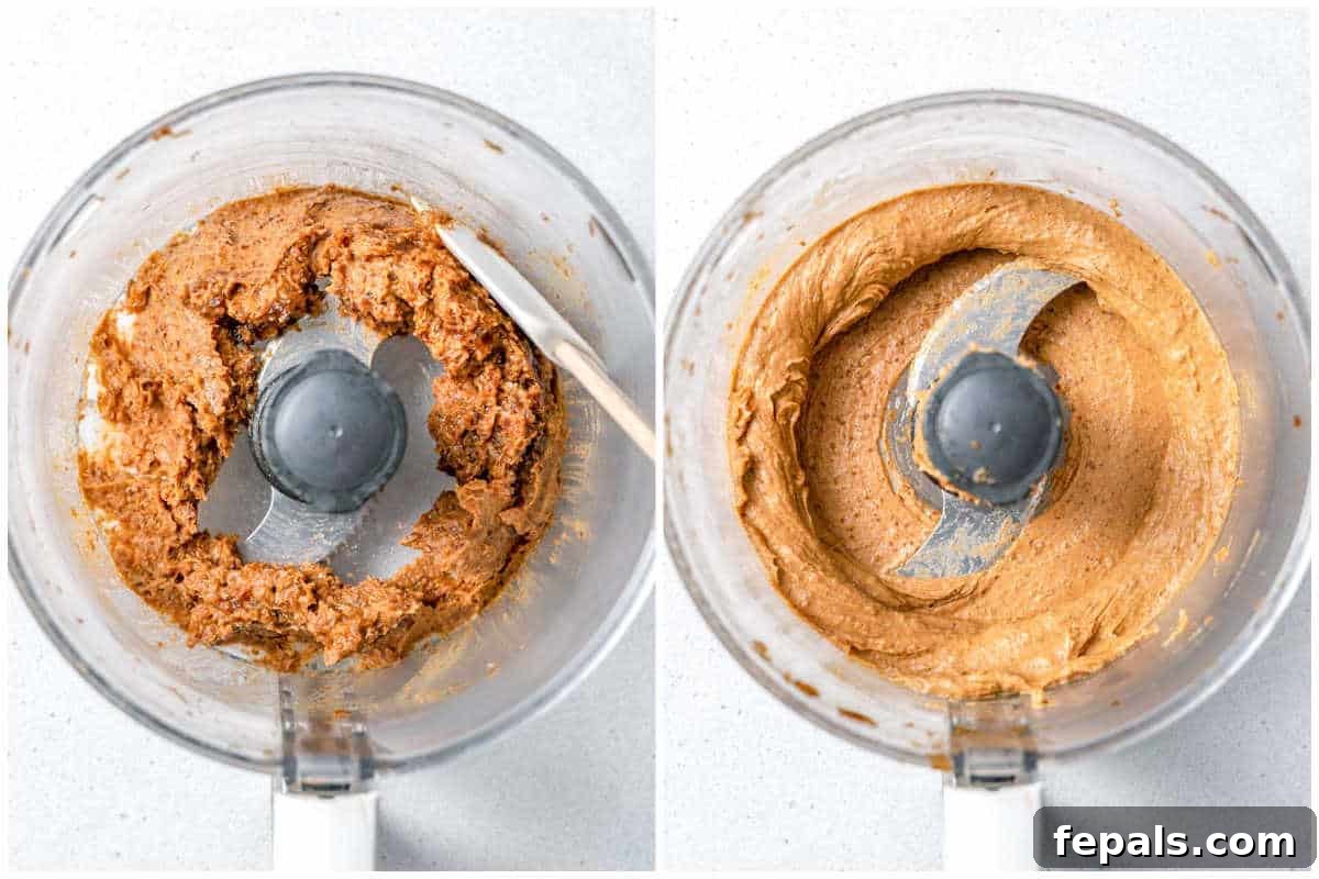 A food processor blending dates and water into a smooth, thick paste.