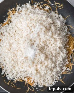 Classic Lebanese Vermicelli Rice 12 Rinsed rice and salt added to the toasted vermicelli in the pan.