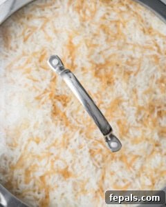 Classic Lebanese Vermicelli Rice 14 A lid covering the pan of rice as it steams and rests.