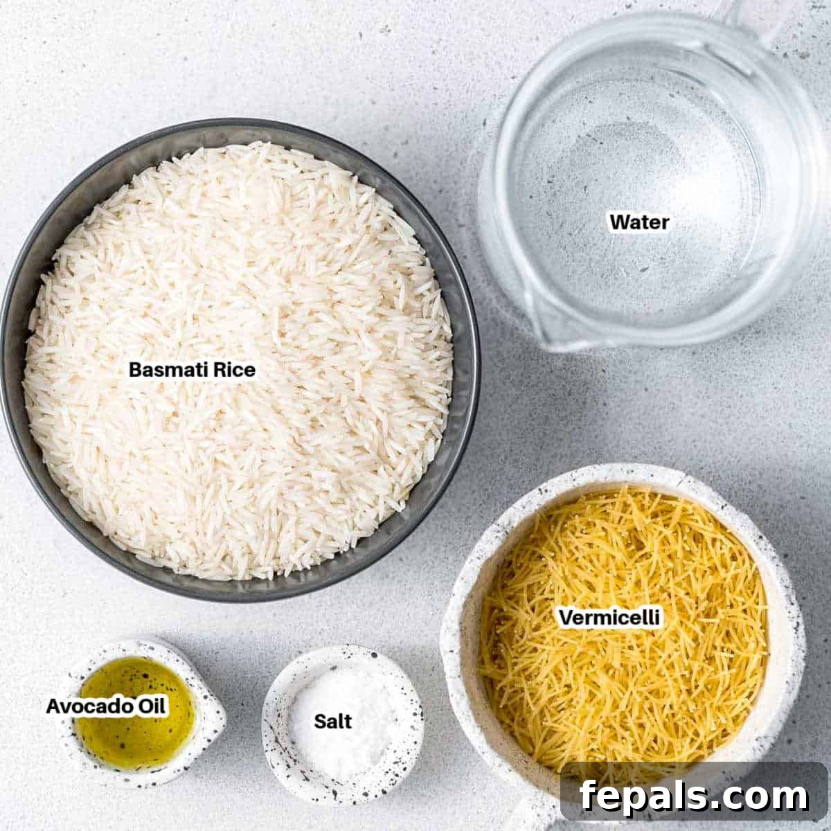 Classic Lebanese Vermicelli Rice 3 Ingredients for Lebanese Rice displayed on a counter, including a bowl of Basmati rice, vermicelli pasta, oil, and salt.