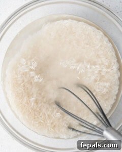 Classic Lebanese Vermicelli Rice 10 rice being soaked in a bowl to remove starch.