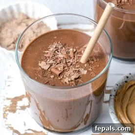 a cup filled with chocolate and peanut butter smoothie.