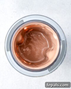 The blended cottage cheese chocolate pudding inside the blender canister, showing a smooth texture.