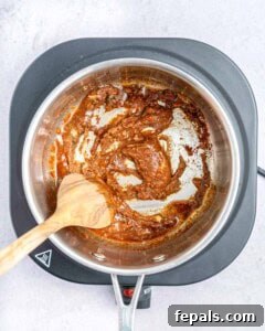 Cooking the seasonings in a saucepan.
