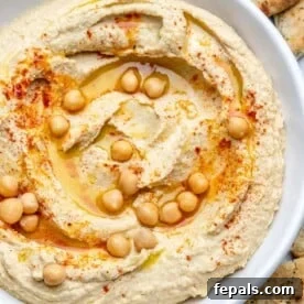 homemade hummus in a white dish