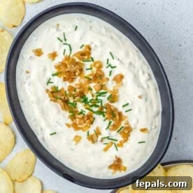 French onion dip in a black bowl