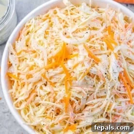 close up of coleslaw salad in a white bowl