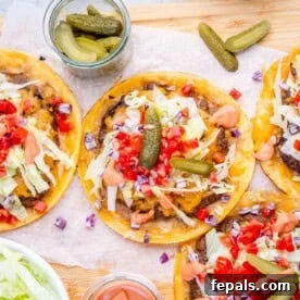 smash burger tacos laid out with burger toppings.