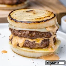 dutchman burger bunless with sliced onions and melted cheese