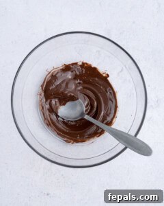 No-Bake Peanut Butter Oat Cups Recipe 13 melted chocolate in a bowl.