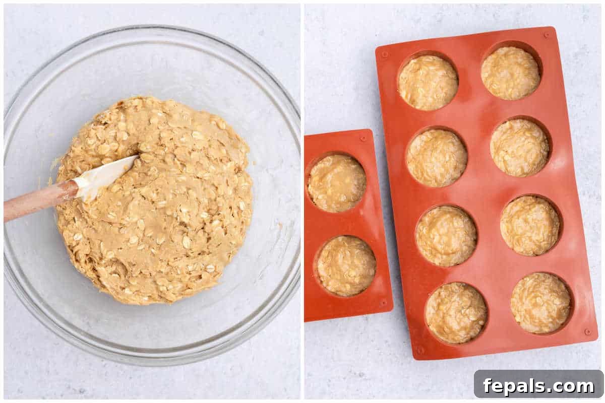 No-Bake Peanut Butter Oat Cups Recipe 5 placing the peanut butter dough in the silicone molds.