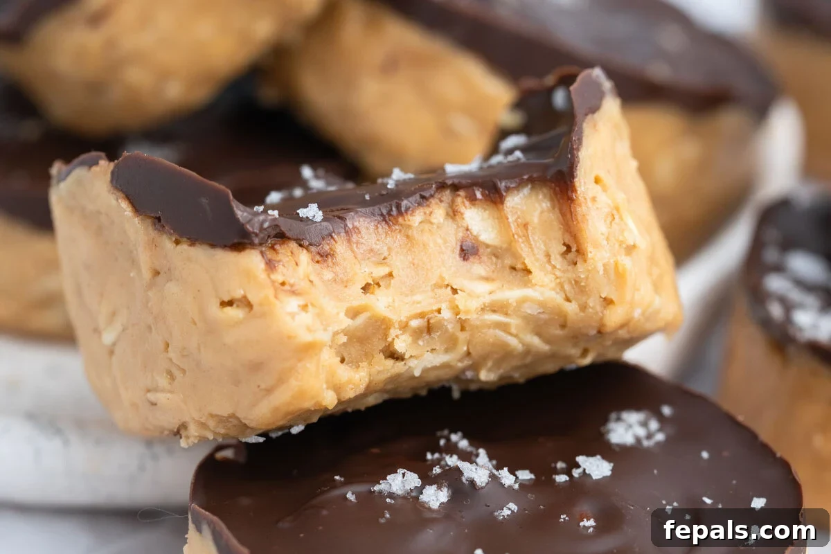 No-Bake Peanut Butter Oat Cups Recipe 7 peanut butter oat cups laid over each other.