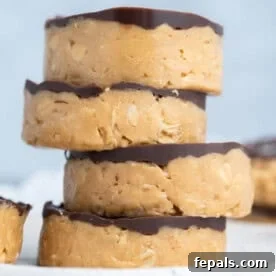 No-Bake Peanut Butter Oat Cups Recipe 9 peanut butter oat cups stacked over each other.