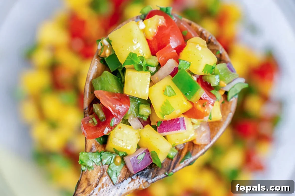 a spoonful of mango pico de gallo.