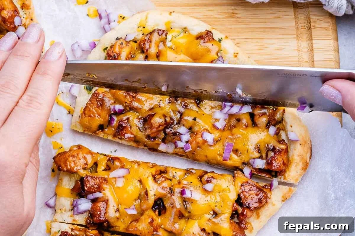 Quick BBQ Chicken Flatbread Recipe for Weeknight Dinner 7 slicing bbq chicken naan.